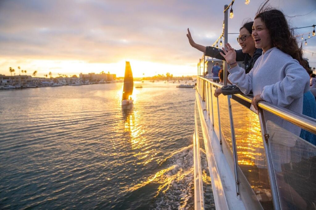 Guests enjoying a successful fishing charter aboard a center console boat.