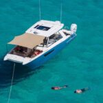 A guided boat snorkeling tour in crystal-clear Mediterranean waters.