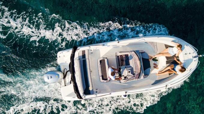 Modern water taxi transporting tourists across crystal-clear Adriatic waters between coastal destinations.