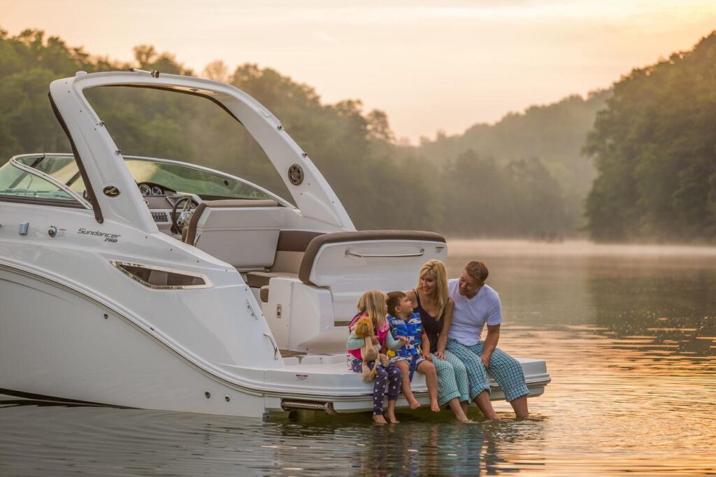 Happy family enjoying a private boat day with children on calm water in the USA.