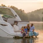 Happy family enjoying a private boat day with children on calm water in the USA.