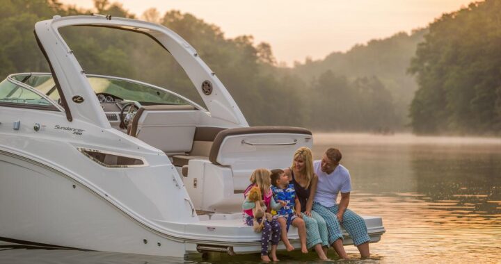 Happy family enjoying a private boat day with children on calm water in the USA.