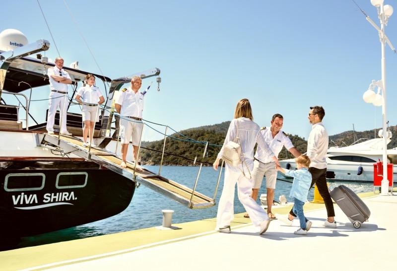 Travelers boarding a private boat charter for a day on the water, reflecting the growth of the sharing economy.