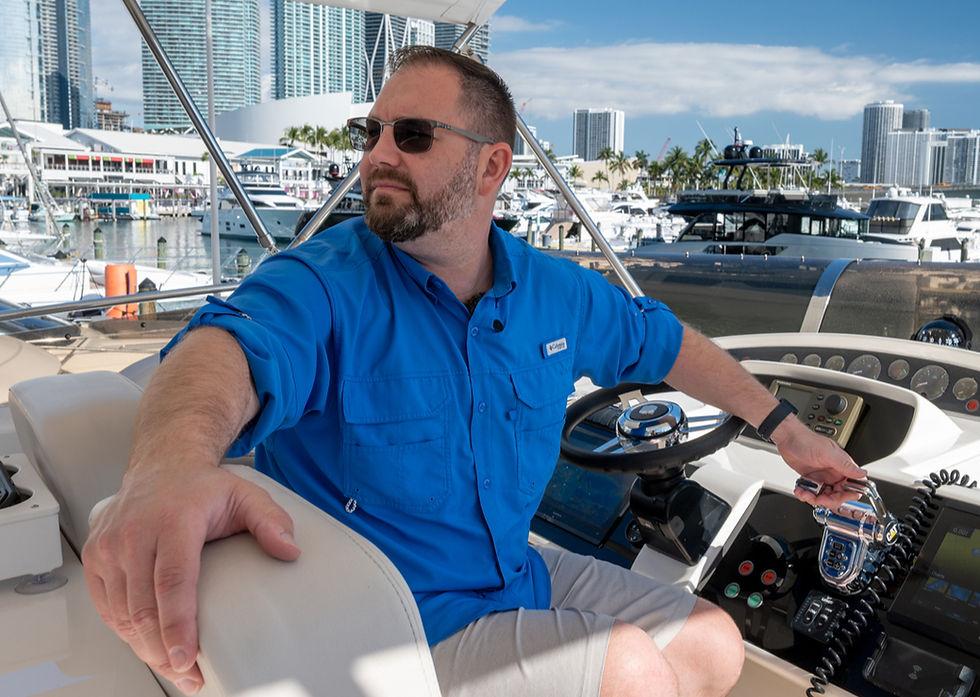 Professional boat captain working on a charter yacht in Florida marina, representing boat crew jobs in the USA in 2026.