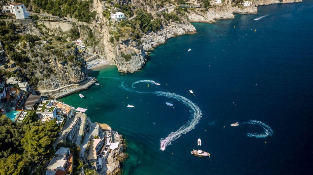 Boat entering the famous Blue Grotto on Capri, one of Italy's most iconic sea cave experiences.