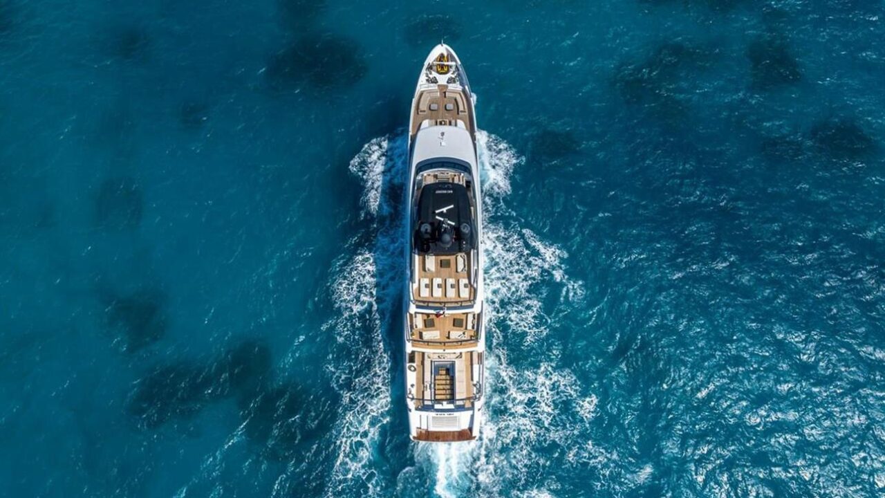 A luxury yacht gliding across the turquoise waters of the Côte d’Azur.