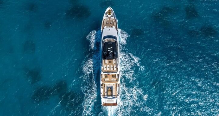 A luxury yacht gliding across the turquoise waters of the Côte d’Azur.