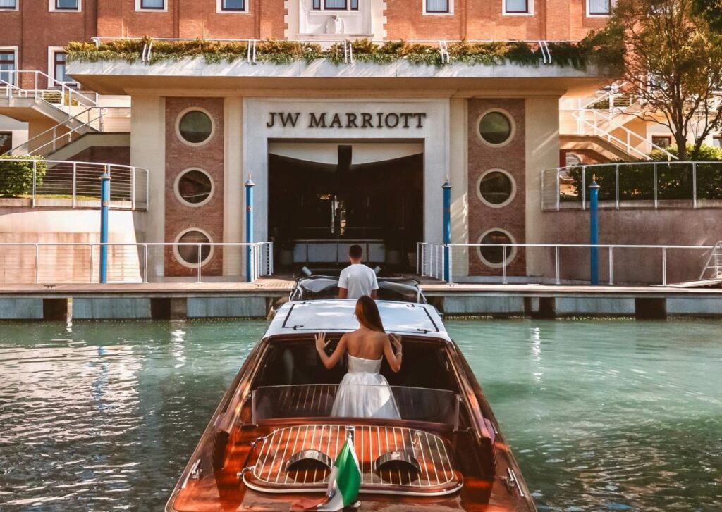 Private boat transfer collecting hotel guests from a waterfront resort.
