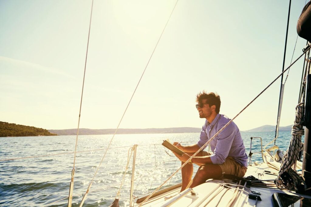 Relaxing on a sailboat without digital distractions during a weekend getaway.
