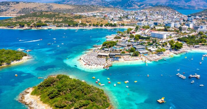 Aerial view of the Albanian Riviera with turquoise Ionian waters and untouched coastline near Ksamil.