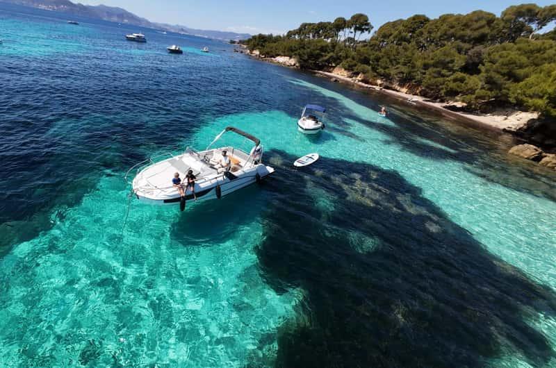 A private yacht anchored beside the crystal-clear waters of the Lérins Islands.