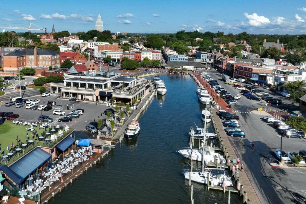 Historic Annapolis harbor with sailboats docked along the waterfront.