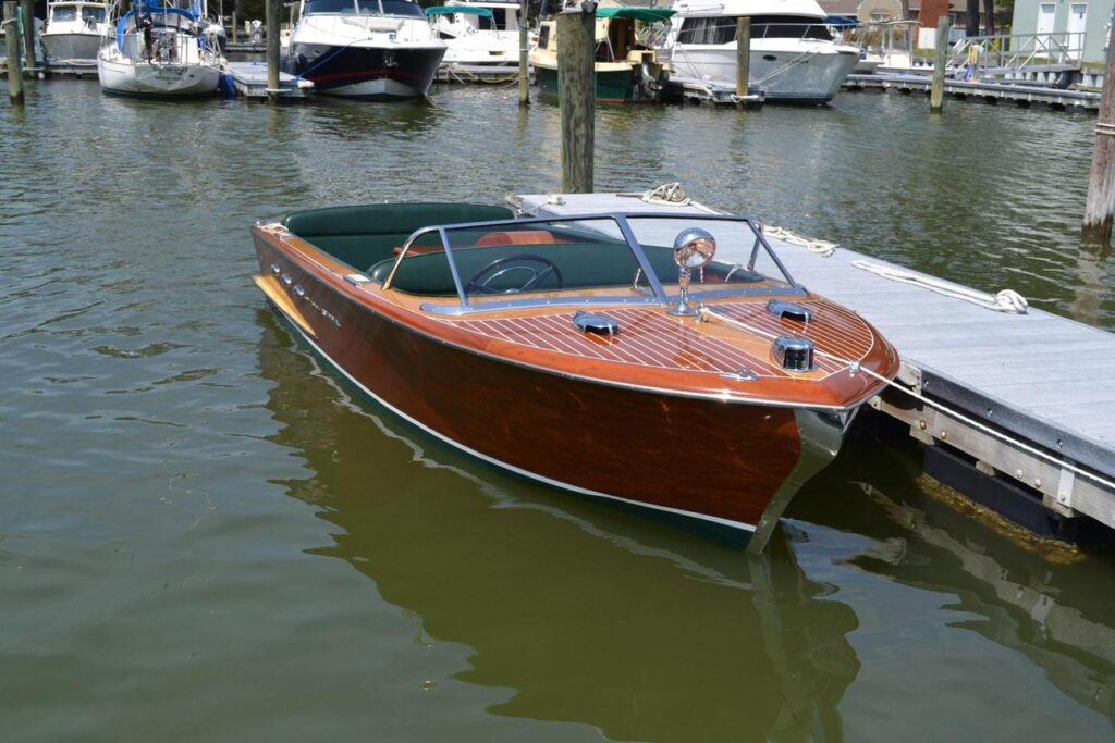 Restored classic wooden Chris-Craft attracting visitors with timeless craftsmanship and premium charter appeal.