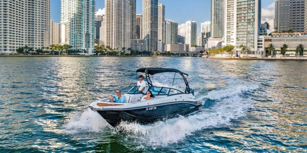 Charter guests boarding a center console boat before departing from a Miami marina.